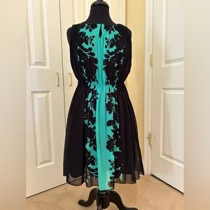 NWT. Sheer over black lining. 100% poly, machine wash. Easter/Work/Church/Party.